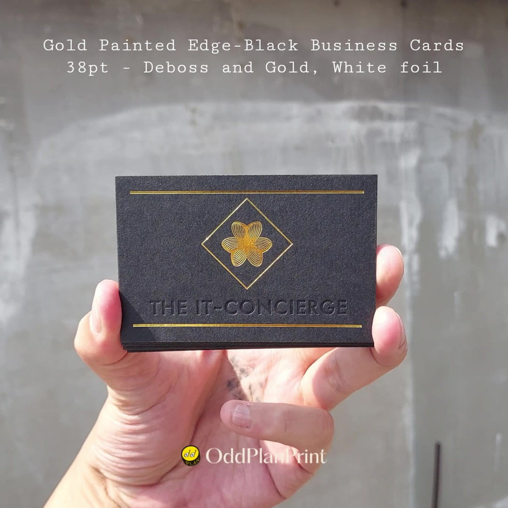 Gold painted edged 38pt black business cards with deboss, gold and white foil by OddPlanPrint.