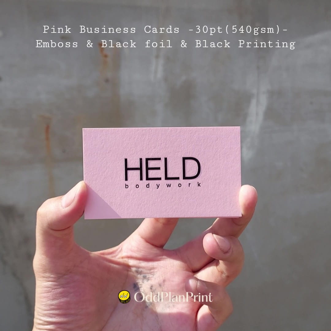 Pink business cards a confident edge alongside crisp black printing, raised black foil by OddPlanPrint.