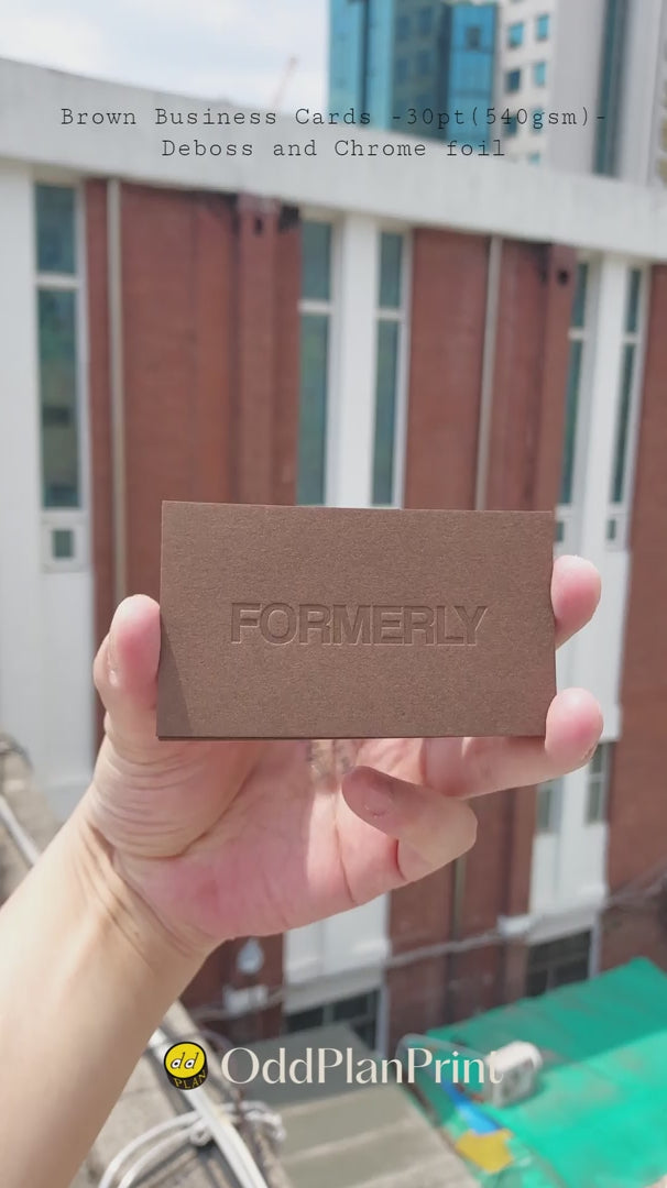 High quality brown business cards 30pt with blind deboss depth and chrome foil accents from OddPlanPrint.