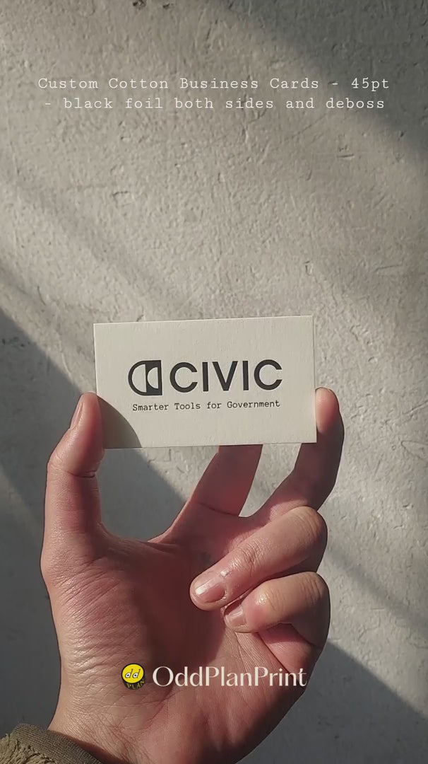Premium 45pt cotton business card with deep debossing and black foil stamping. Emphasizes tactile luxury and unmatched quality for high-end branding. from OddPlanPrint.