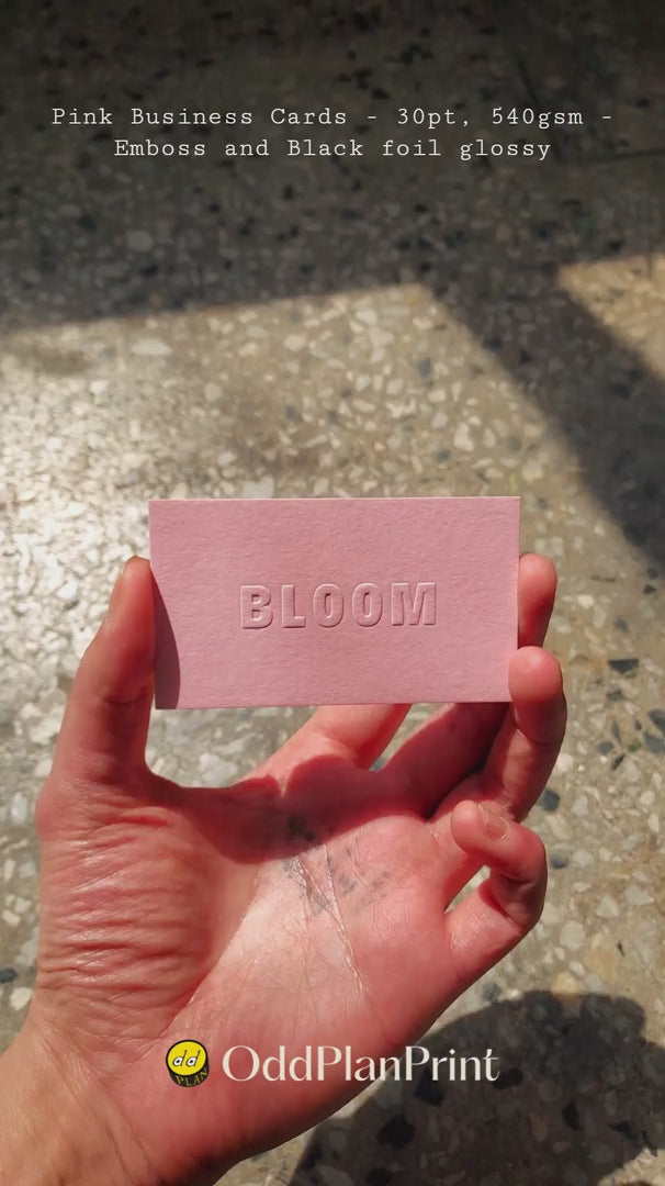 Thick pink business cards with raised emboss and glossy black foil accents made by oddplanprint
