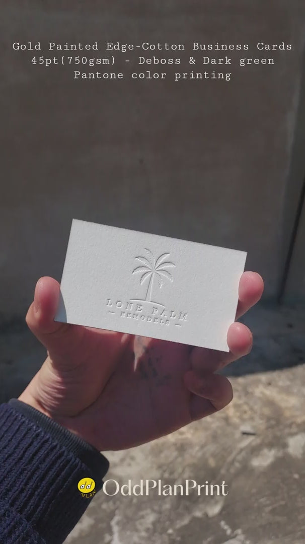 High-end 45pt 750gsm cotton business cards showing gold painted edges, tactile deboss and dark green Pantone color by OddPlanPrint.
