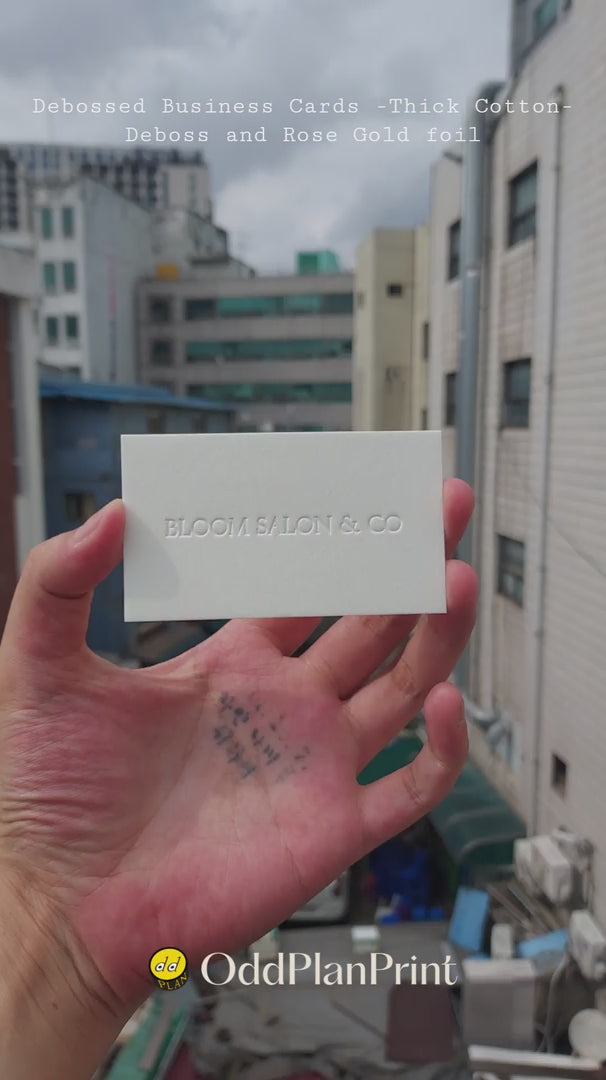 Premium thick cotton 45pt debossed business cards with rose gold foil by OddPlanPrint.