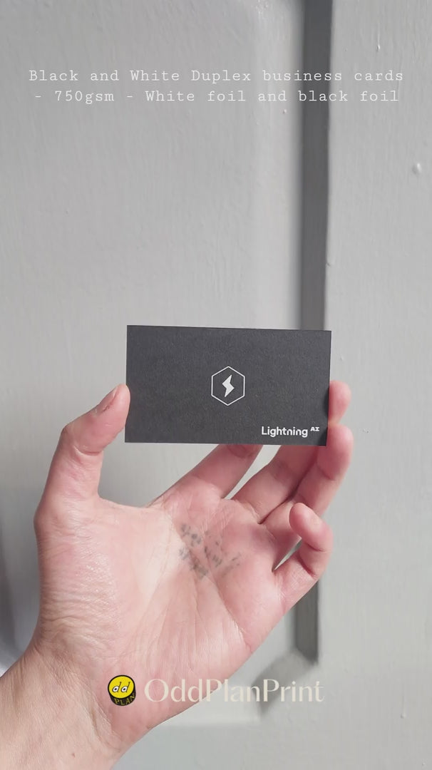 OddPlanPrint presents a minimalist yet powerful 750gsm black and white duplex business card, featuring subtle white foil on black and black foil on white.