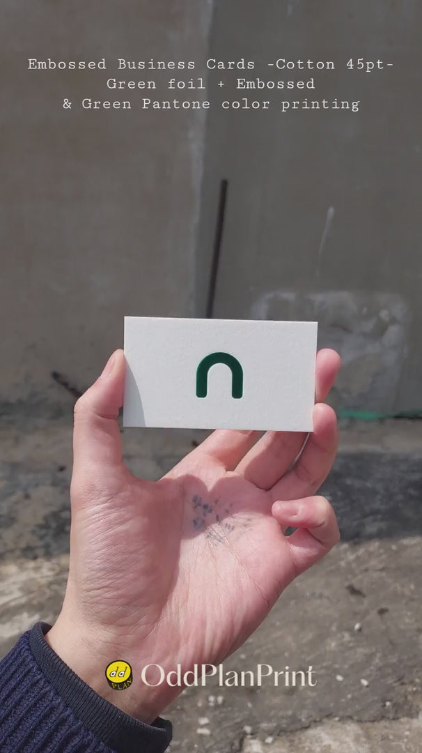 45pt cotton embossed business cards with green foil and emboss on front green pantone back by OddPlanPrint