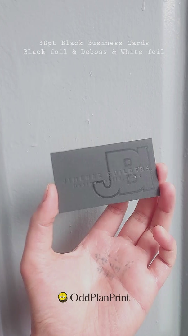 Luxury black business cards 38pt thick with deboss logo and black foil front, white foil back from OddPlanPrint