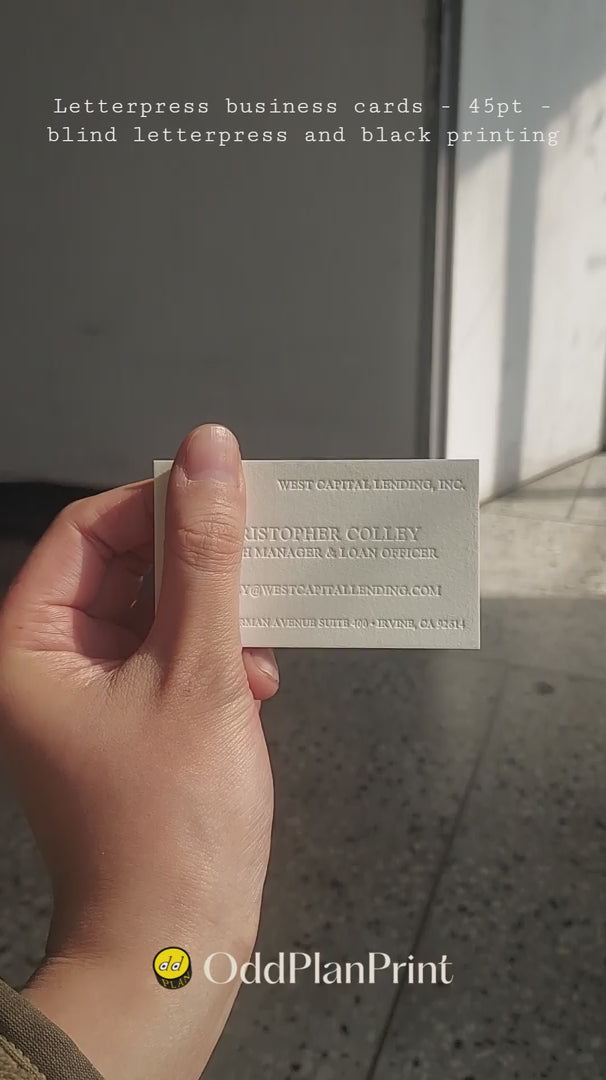 Minimalist 45pt cotton business card with blind letterpress texture and black ink, designed by OddPlanPrint.